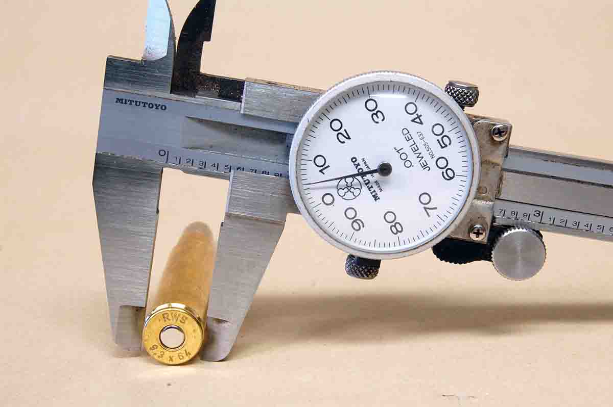 A dial caliper shows the unique diameter of a 9.3x64 Brenneke case.